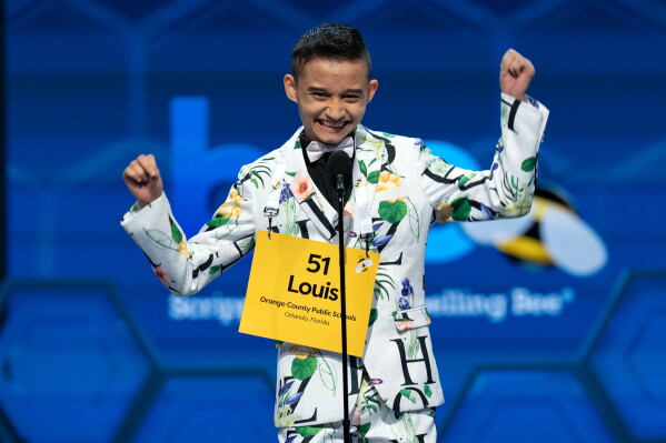 Louis Avetis, 13, of Orlando, Fla., jumps after spelling his word correctly during the quarterfinals of the Scripps National Spelling Bee at DAR Constitution Hall, Wednesday, May 27, 2026, in Washington. (AP Photo/Jose Luis Magana)