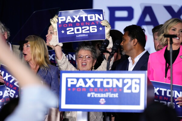 Attendees celebrate after Texas Attorney General Ken Paxton, a Republican candidate for the U.S. Senate, won the Republican party's nomination during a primary runoff election night event Tuesday, May 26, 2026, in Plano, Texas. (AP Photo/Tony Gutierrez)