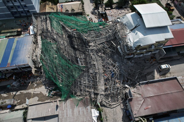 A collapsed building where multiple people are believed to be trapped in Angeles city in Pampanga province, north of Manila, Philippines Sunday, May 24, 2026. (AP Photo/Aaron Favila)