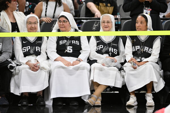 Spectators look on prior to Game 4 in the Western Conference finals NBA basketball playoffs series between the San Antonio Spurs and the Oklahoma City Thunder in San Antonio, Sunday, May 24, 2026. (AP Photo/Darren Abate)