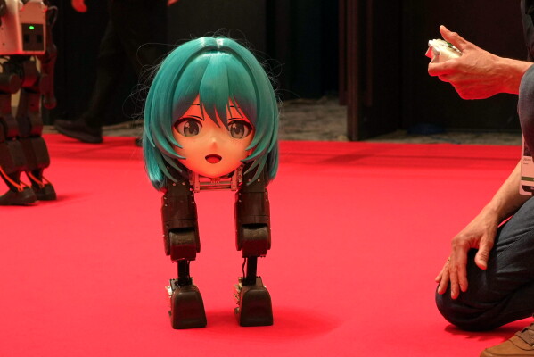 High Torque's Mini Pi bipedal robot is operated at the Humanoids Summit 2026 in Tokyo, Thursday, May 28, 2026. (AP Photo/Ayaka McGill)