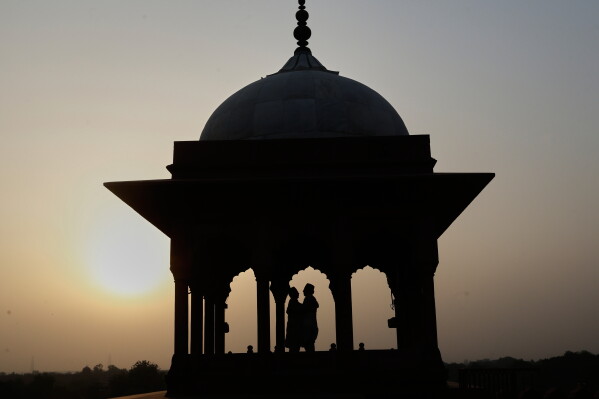Devout Muslims greet and hug after offering Eid al-Adha prayers at the Jama Masjid, in New Delhi, Thursday, May 28, 2026. (AP Photo/Shekhar Yadav)