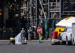 Hazardous materials workers at Nippon Dynawave Packaging Co. on May 27, 2026.