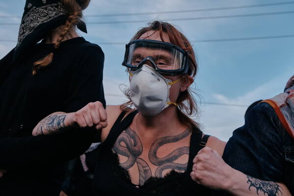 Protesters confront ICE agents outside the Delaney Hall detention center while demonstrating near the entrance gates, Wednesday, May 27, 2026, in Newark, N.J. (AP Photo/Andres Kudacki)