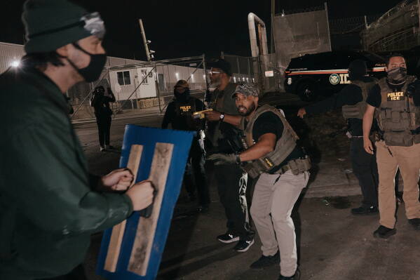 Protesters clash with ICE agents outside the Delaney Hall detention center while demonstrating near the entrance gates, Wednesday, May 27, 2026, in Newark, N.J. Inside the facility, detainees carried out a labor and hunger strike for days over alleged living conditions. (AP Photo/Andres Kudacki)