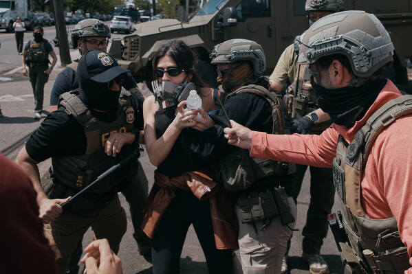 Protesters and ICE agents clash outside the Delaney Hall detention center after demonstrators stood by the entrance gates to protest the transfer of detainees on Tuesday, May 26, 2026, in Newark, N.J. (AP Photo/Andres Kudacki)