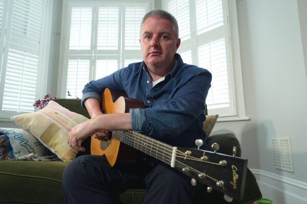 Musician Samuel Smith poses for a photo at his home, in London, Tuesday, May 12, 2026. (AP Photo/Mustakim Hasnath)