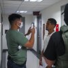 An Immigration and Customs Enforcement (ICE) agent uses facial recognition software to confirm an asylum seeker's identity prior to an immigration hearing on July 30, 2025, in New York. In addition, DHS is expanding its use of iris scanners to help quickly identify undocumented immigrants.