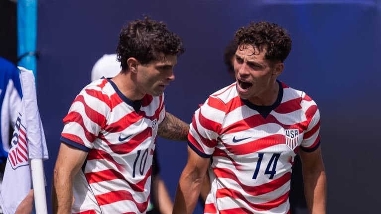 United States forward Christian Pulisic (10) celebrates with midfielder Sebastian...