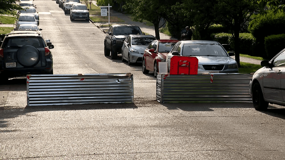 A group of unknown residents installed these large metal planter containers on 97th, 98th and 102nd Streets off of Aurora Avenue North, with a typed letter attached to them explaining that they are there to deter the vehicles of criminals from coming into their neighborhoods. (KOMO)