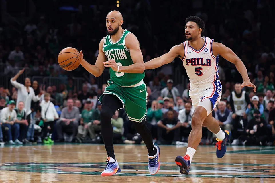 BOSTON, MASSACHUSETTS - MAY 02: Derrick White #9 of the Boston Celtics is defended by Quentin Grimes #5 of the Philadelphia 76ers during the fourth quarter in Game Seven of the First Round of the NBA Eastern Conference Playoffs at TD Garden on May 02, 2026 in Boston, Massachusetts. NOTE TO USER: User expressly acknowledges and agrees that, by downloading and or using this photograph, User is consenting to the terms and conditions of the Getty Images License Agreement. (Photo by Maddie Meyer/Getty Images)
