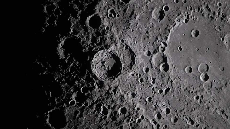 closeup view of the moon's cratered surface