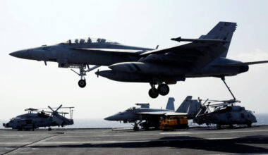 A U.S. Navy F18 fighter jet lands on the deck of aircraft carrier USS Carl Vinson in South China Sea