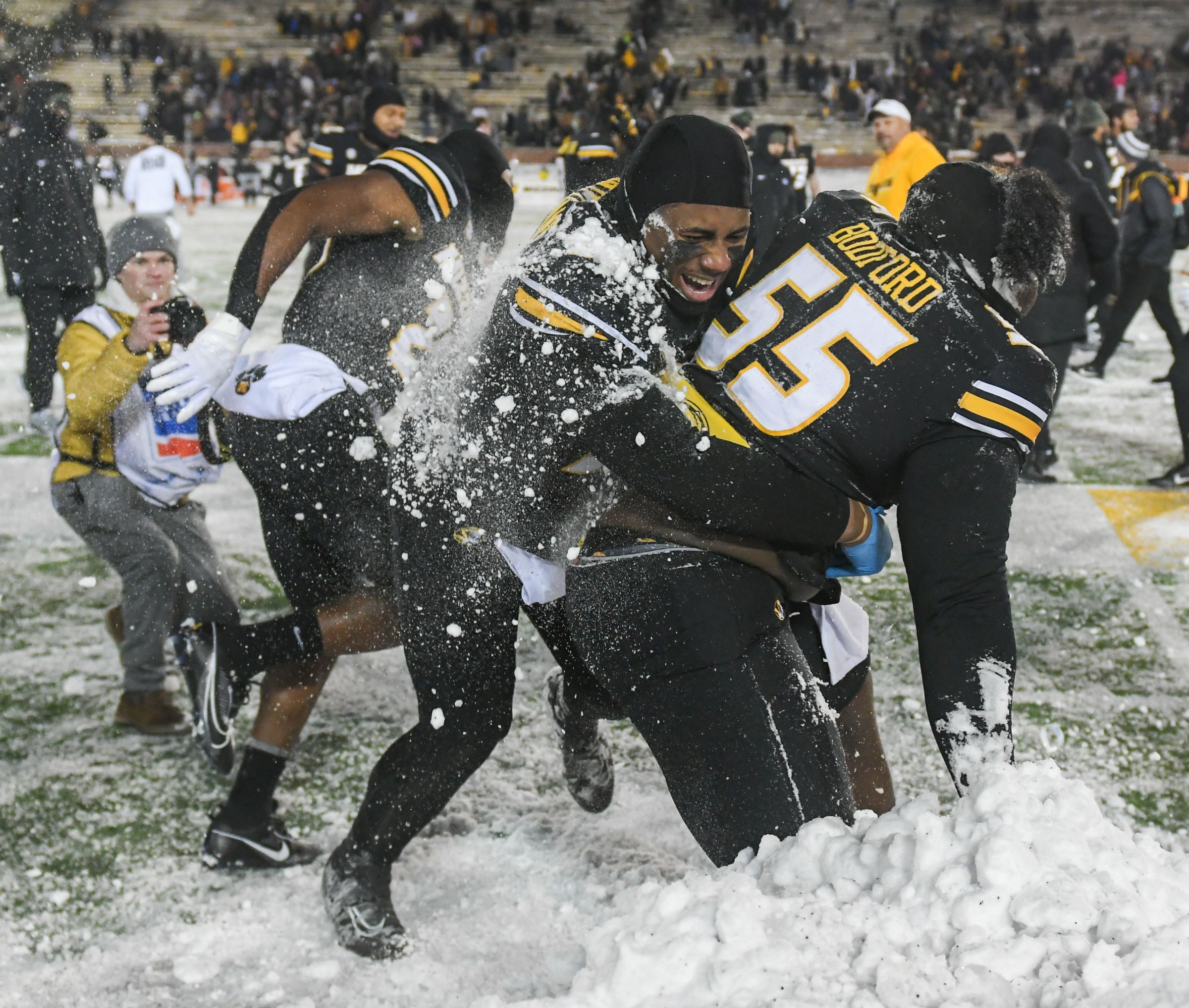 Missouri players have a snow fight after the end of a game against Arkansas on Saturday, Nov. 30, 2024, at Faurot Field.