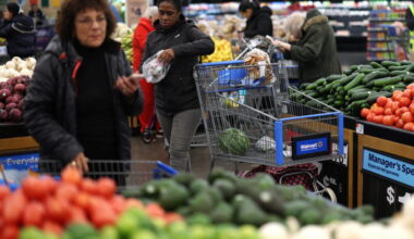 Customers shop for groceries in Walmart Supercenter retail store in North Bergen, New Jersey