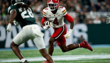 Nov 29, 2025; Detroit, Michigan, USA; Maryland wide receiver Shaleak Knotts (4) runs into Michigan State defensive back Dontavius Nash (28) in the second quarter at Ford Field.
