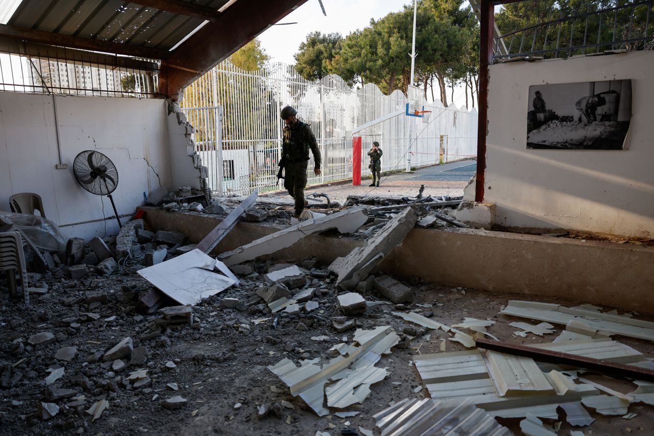 Israeli security personnel inspect damage in Nahariya, Israel, on April 10, after a barrage of projectiles was launched from Iran-backed Hezbollah in Lebanon.