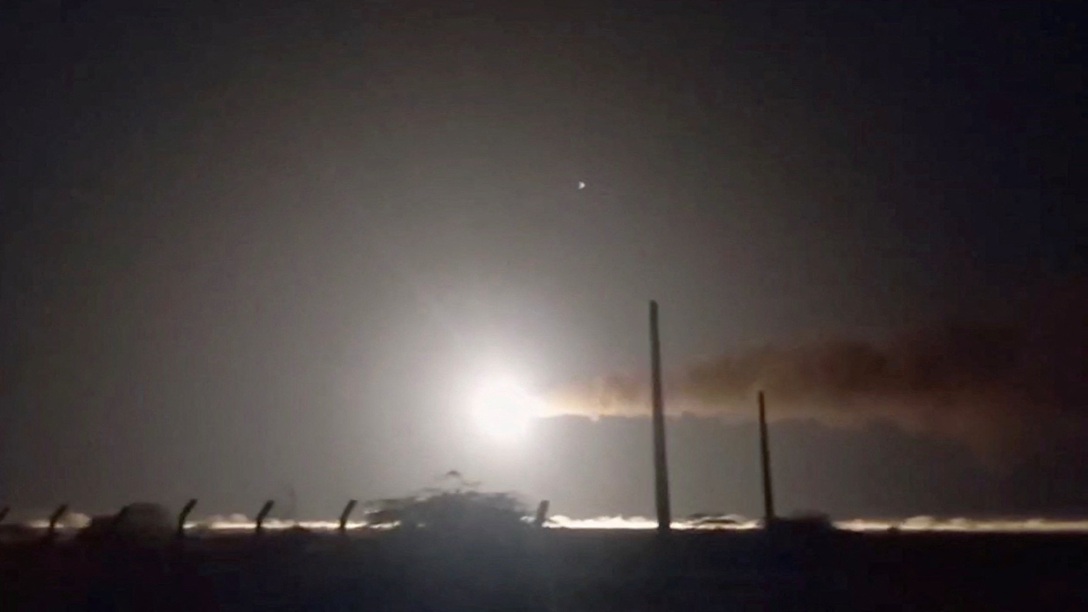 Iranian navy fires a missile, at an unknown location, in this still image taken from a video released