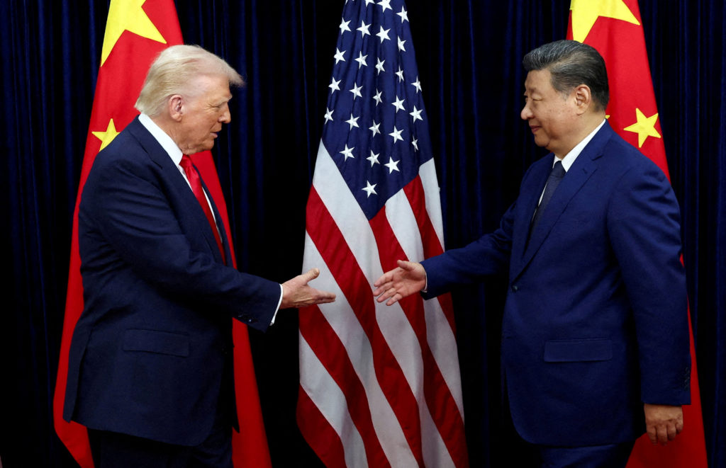 FILE PHOTO: U.S. President Donald Trump meets with Chinese President Xi Jinping on the sidelines of the APEC summit, in Busan