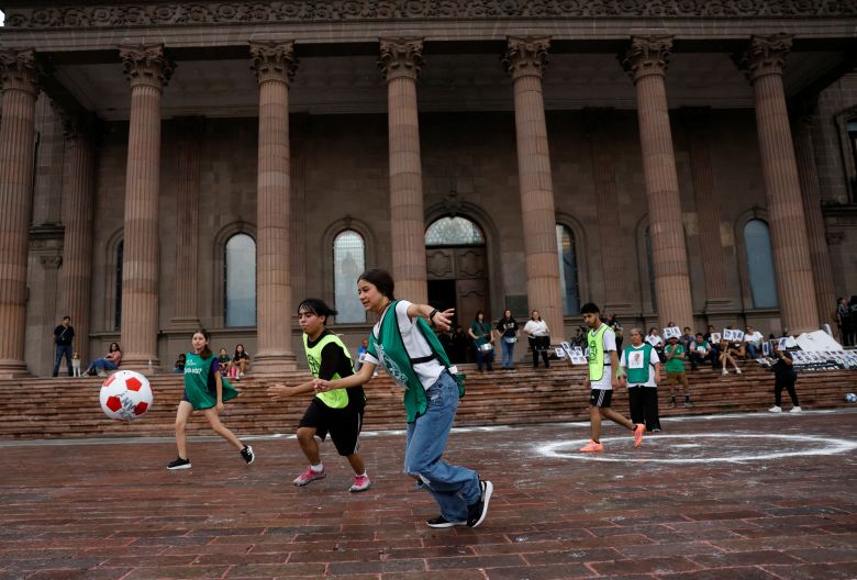 Members of the missing persons search collective United Forces for Our Disappeared in Nuevo Leon (FUNDENL), play soccer in memory of the missing ahead of the World Cup, in front of the Government Palace of Nuevo Leon, in Monterrey, Mexico, May 17, 2026.