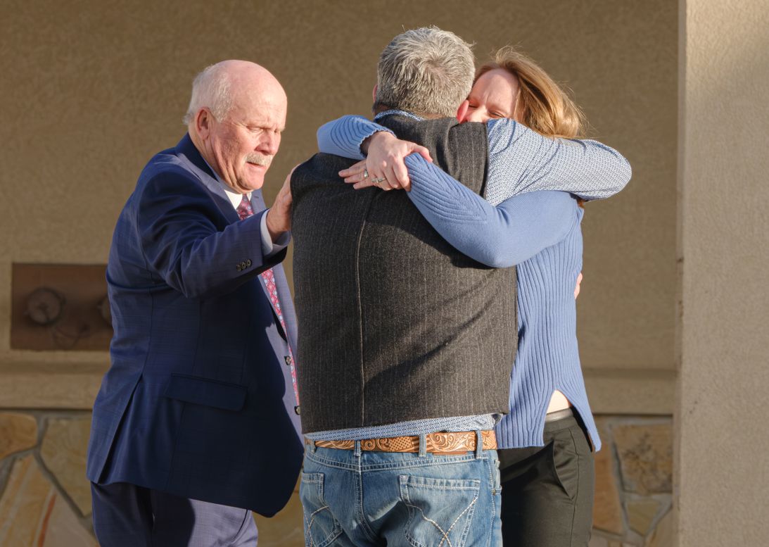 Eric Richins' loved ones embrace and comfort one another after a jury convicted Kouri Richins of his murder on March 16, 2026, in Summit County, Utah.