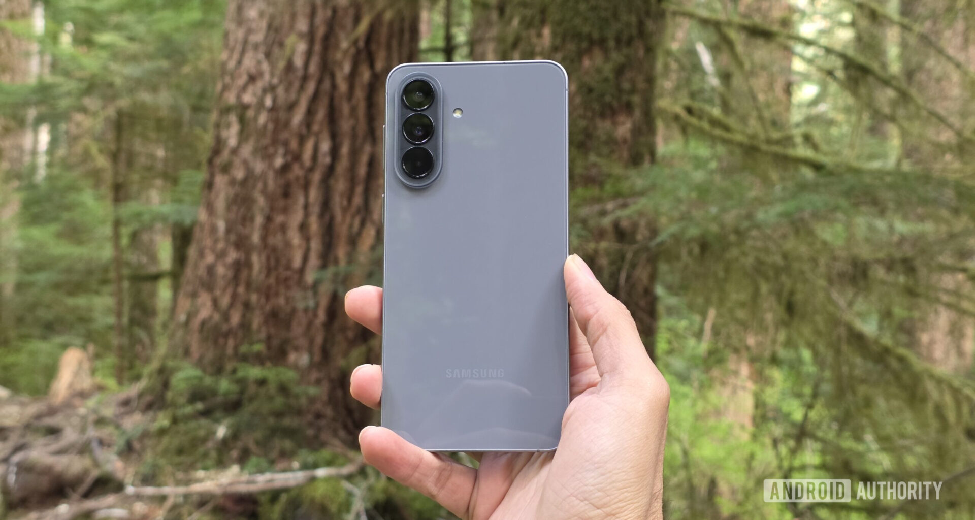 Samsung Galaxy A57 review image showing the phone's back in an outdoor setting