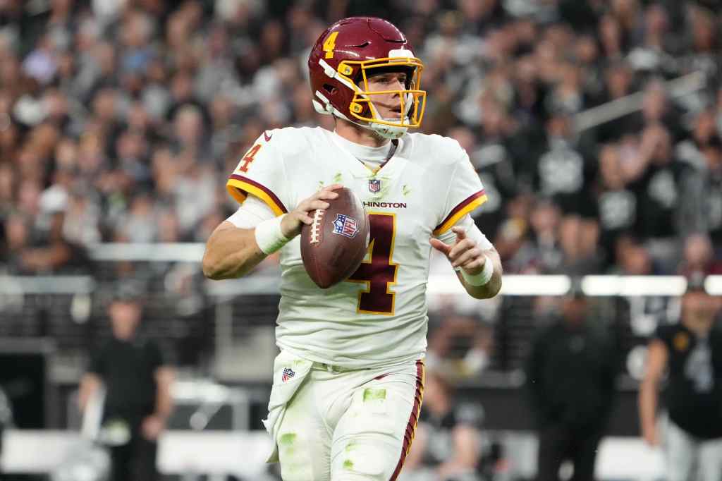 Washington Football Team quarterback Taylor Heinicke (4) throws the ball against the Las Vegas Raiders  in the second half at Allegiant Stadium.