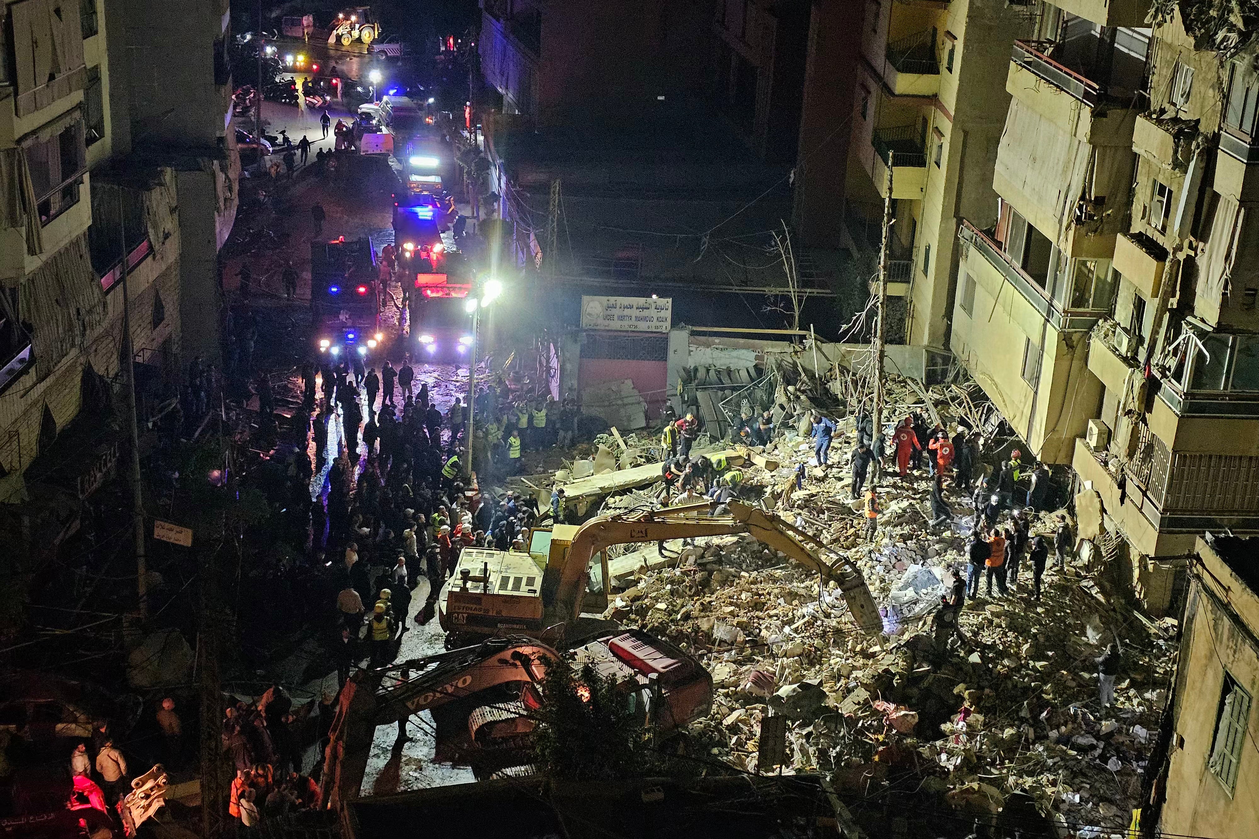 First responders gather at the site of an Israeli airstrike in Beirut's southern suburb of Haret Hreik neighborhood