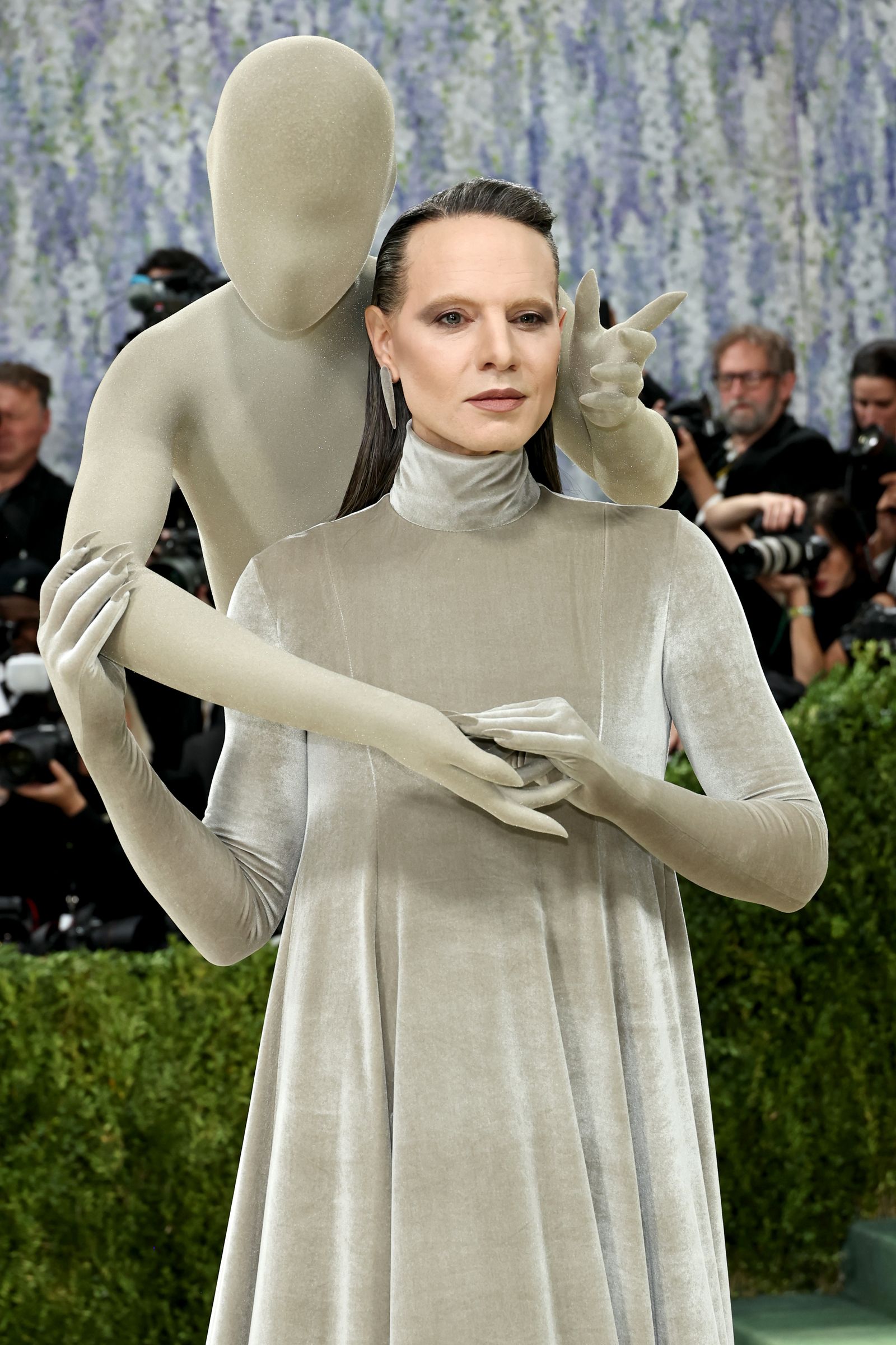 Image may contain Tripp Eisen Adult Person Clothing Costume Glove Face Head and Photobombing