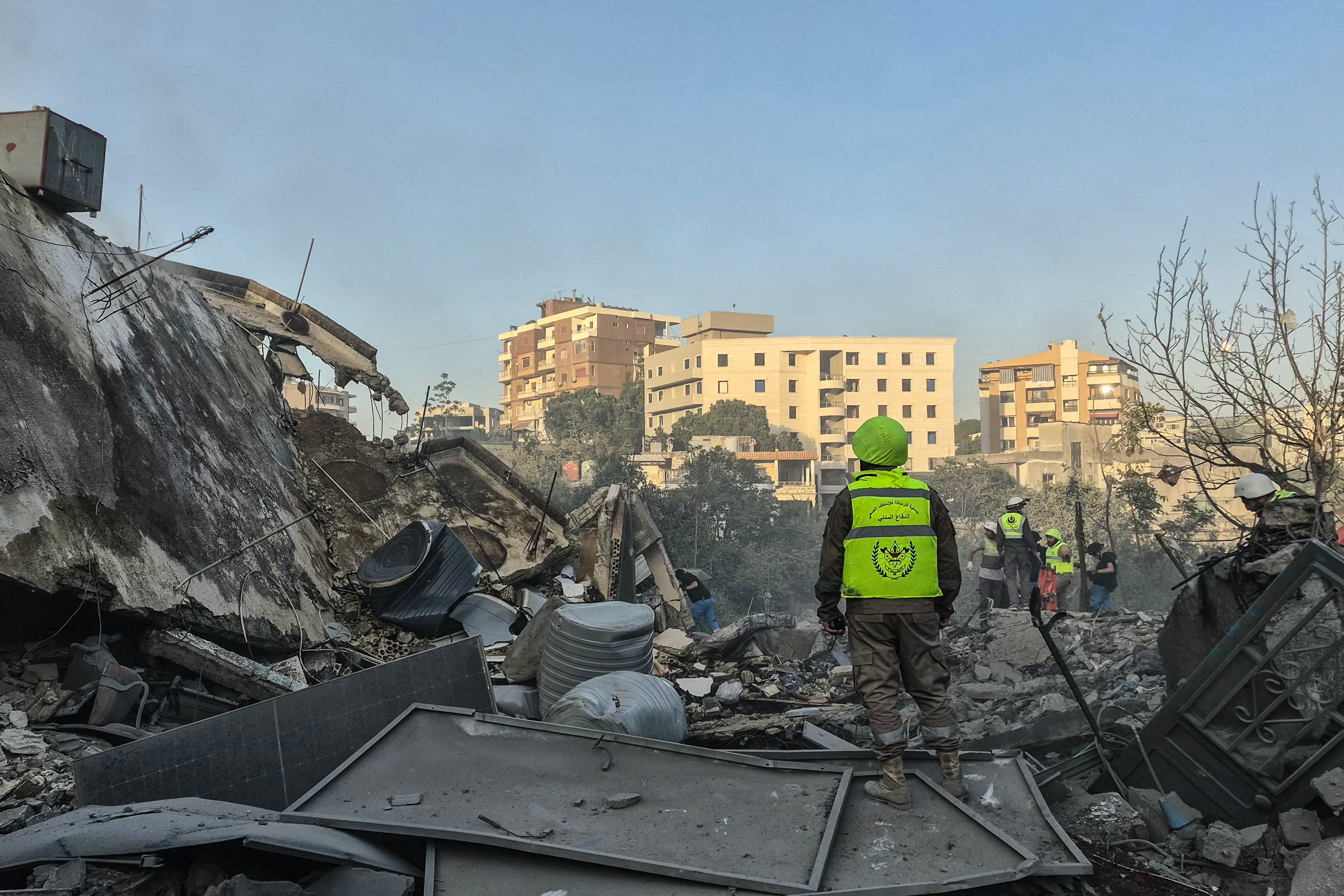 First responders search the rubble for victims at the site of an Israeli airstrike in the southern town of Nabatieh on May 9, 2026