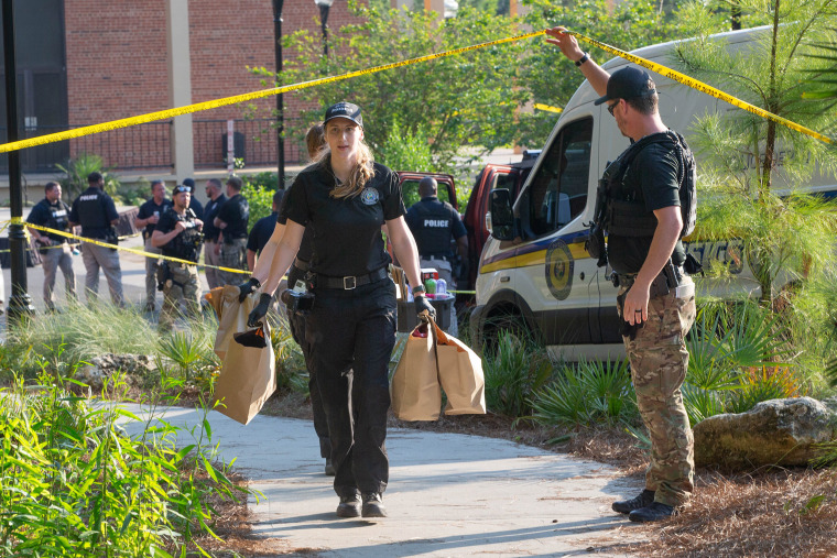 An investigators carries bags
