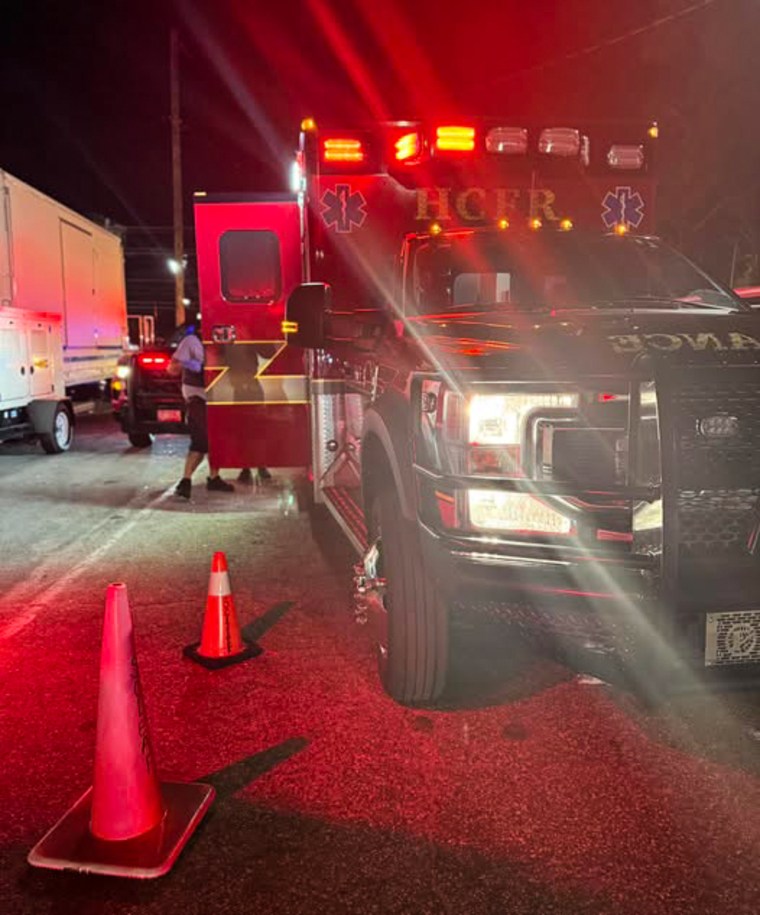 A firetruck parked outside at night