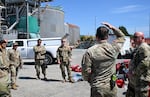 In this supplied photo, responders on the scene at the Nippon Dynawave Packaging Co. incident, May 28, 2026, in Longview, Wash.
