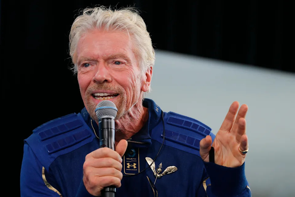 Billionaire entrepreneur Richard Branson wears his astronaut's wings at a news conference after flying July 11, 2021 with a crew in Virgin Galactic's passenger rocket plane VSS Unity to the edge of space.