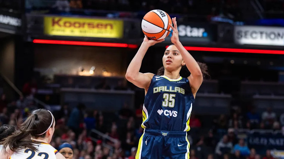 Apr 30, 2026; Indianapolis, IN, USA; Dallas Wings guard Azzi Fudd (35) shoots the ball while Indiana Fever guard <a class="link " href="https://sports.yahoo.com/wnba/players/10154/" data-i13n="sec:content-canvas;subsec:anchor_text;elm:context_link" data-ylk="slk:Caitlin Clark;sec:content-canvas;subsec:anchor_text;elm:context_link;itc:0" data-yga="{"yLinkElement":"context_link","yModuleName":"content-canvas","yLinkText":"Caitlin Clark","ySubModuleName":"anchor_text","yHasCommerce":false}">Caitlin Clark</a> (22) defends in the first half at the Gainbridge Fieldhouse. Mandatory Credit: Trevor Ruszkowski-Imagn Images© Trevor Ruszkowski-Imagn Images&period;