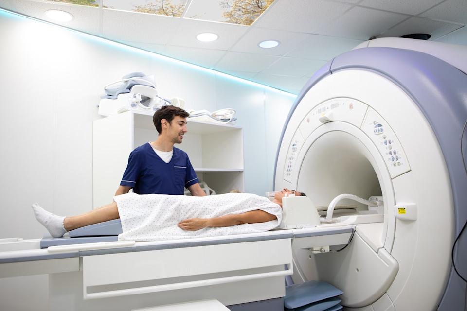 A technician using an MRI machine.