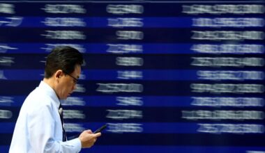 Tokyo stocks hit record, oil and dollar ease on Middle East peace hopes