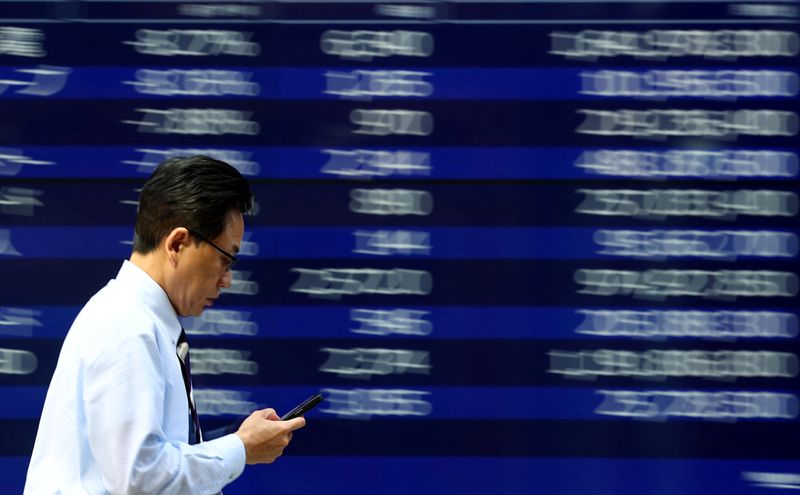 Tokyo stocks hit record, oil and dollar ease on Middle East peace hopes