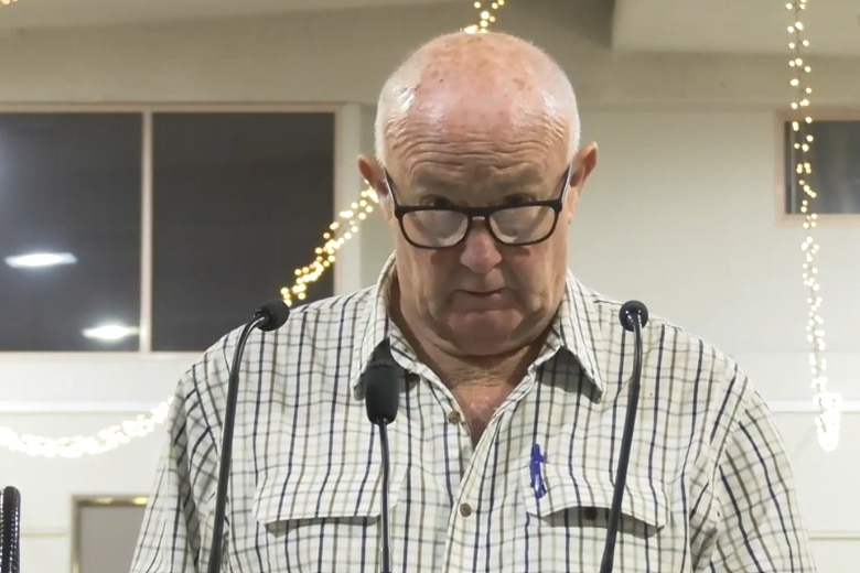 Man talking at inquiry.