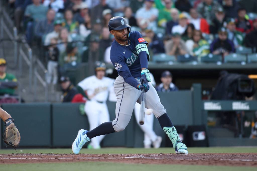 Julio Rodríguez of the Seattle Mariners hits an RBI single during the fourth inning against the Athletics at Sutter Health Park on Tuesday, May 26, 2026, in West Sacramento, California. (Scott Marshall / Getty Images / Tribune News Services)