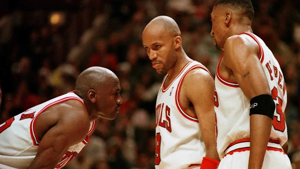 7 Jun 1996: Michael Jordan of the Chicago Bull, left, discusses strategy with teammates Ron Harper, center, and Scottie Pippen during a time-out on the court during the fourth quarter of game two in the NBA Finals at the United Center in <a class="link " href="https://sports.yahoo.com/nba/teams/chicago/" data-i13n="sec:content-canvas;subsec:anchor_text;elm:context_link" data-ylk="slk:Chicago;sec:content-canvas;subsec:anchor_text;elm:context_link;itc:0" data-yga="{"yLinkElement":"context_link","yModuleName":"content-canvas","yLinkText":"Chicago","ySubModuleName":"anchor_text","yHasCommerce":false}">Chicago</a>, Illino