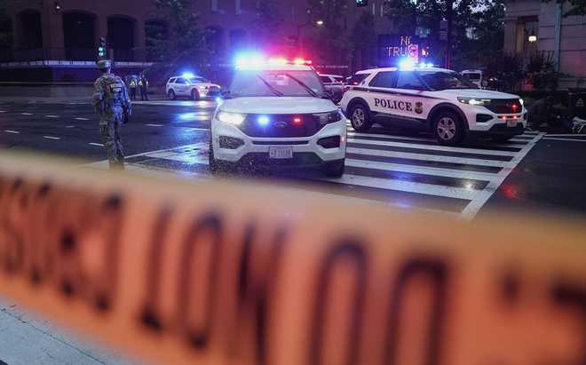 U.S. Secret Service Police are seen on a crime scene after responding to reports of shots fired near the White House, Saturday, May 23, 2026, in Washington.