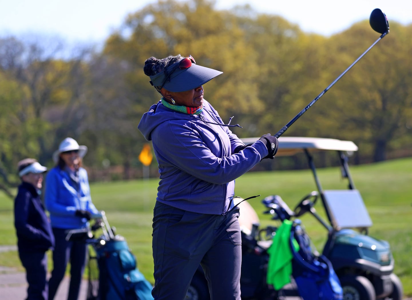 Debra Watson, of Boston, teed off at the William J. Devine Golf Course.