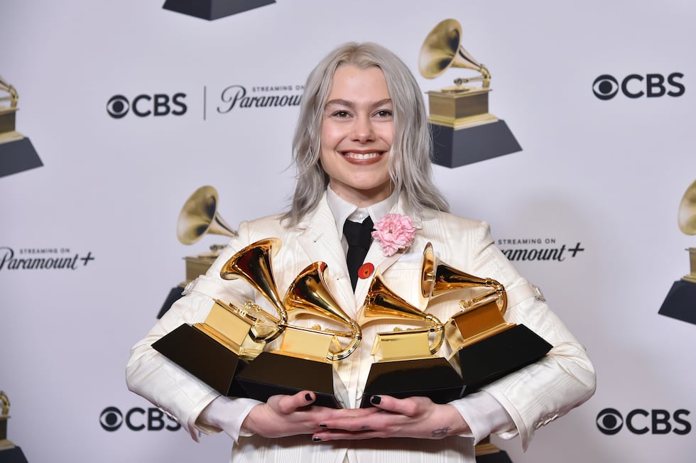 Phoebe Bridgers poses in the press room with the awards for best pop duo/group performance for...