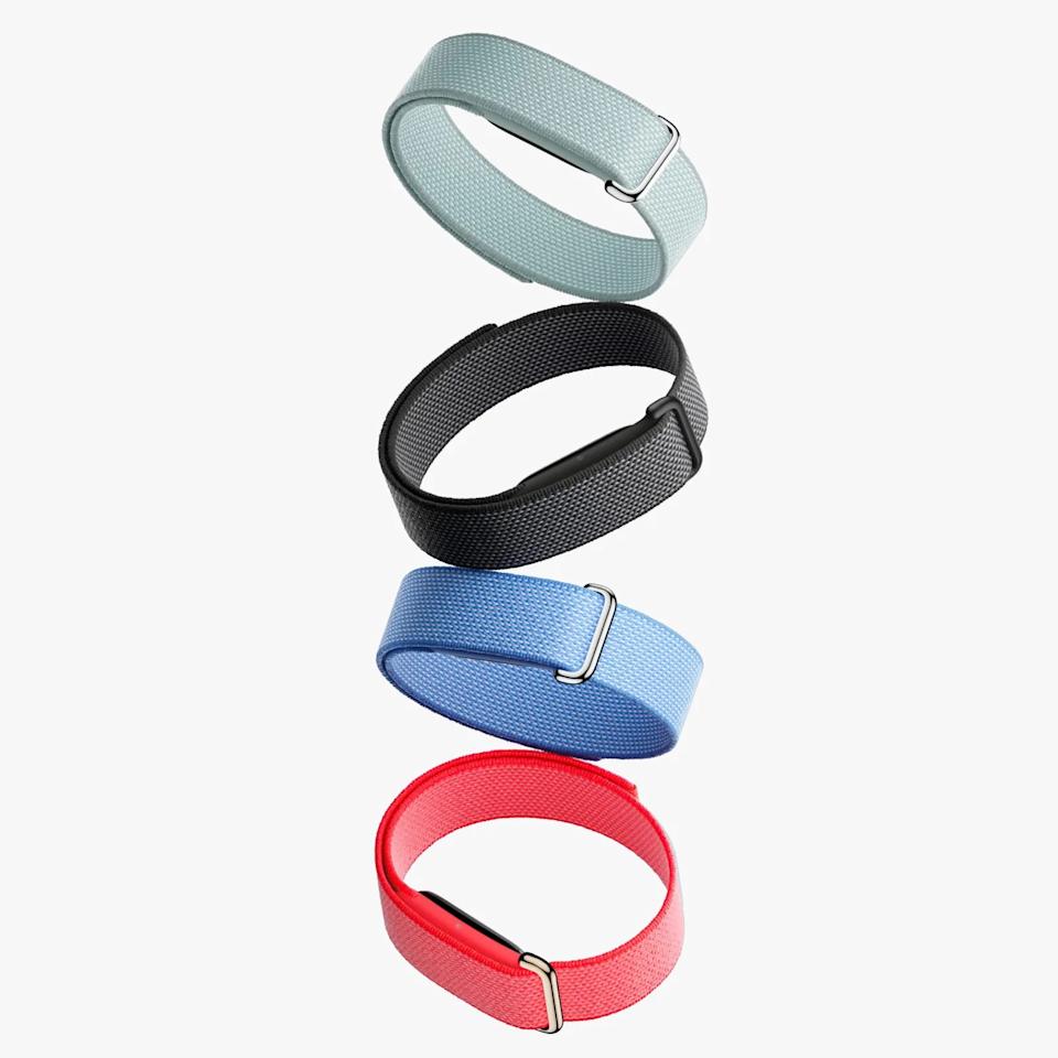 Four woven nylon watch bands in light gray, black, blue, and red colors stacked vertically.