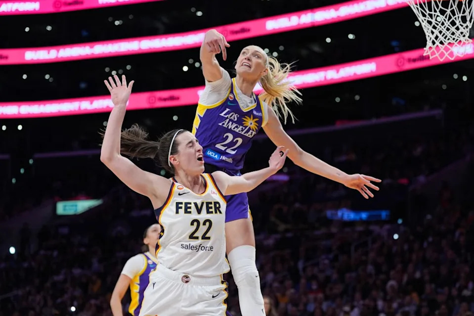Los Angeles Sparks forward Cameron Brink, top, blocks a shot by Indiana Fever guard Caitlin Clark during the first half of a WNBA basketball game Wednesday, May 13, 2026, in Los Angeles. AP