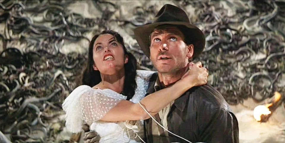 Karen and Harrison Ford in the iconic Raiders of the Lost Ark