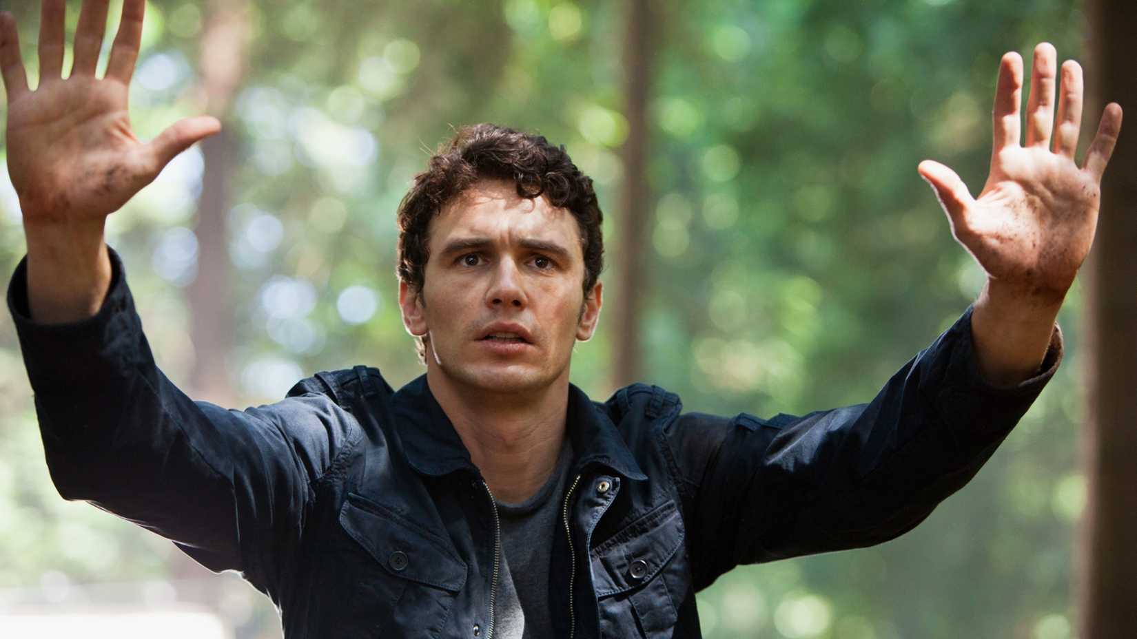 James Franco raises his hands in Rise of the Planet of the Apes