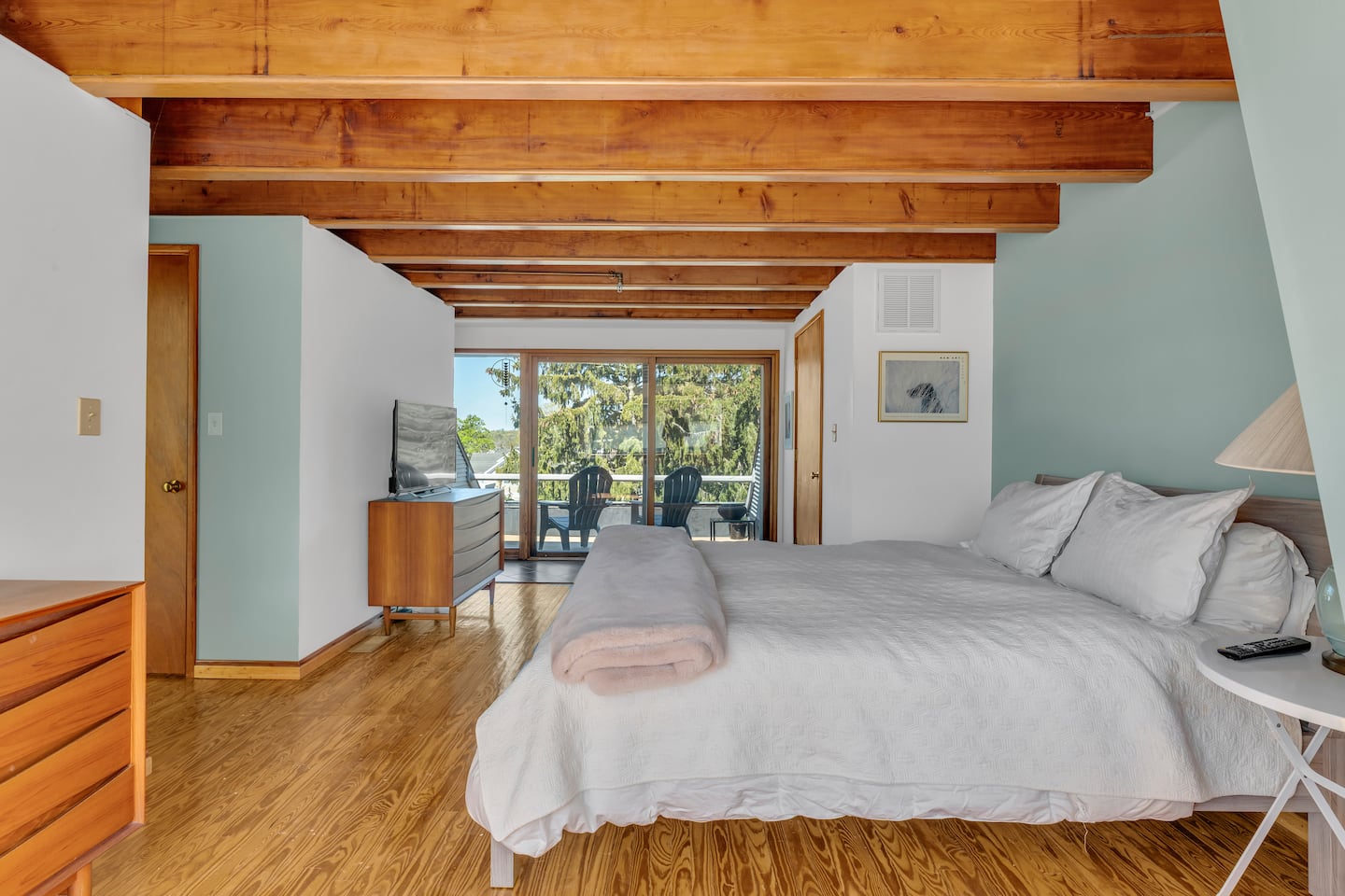 The bedroom has an attached balcony.