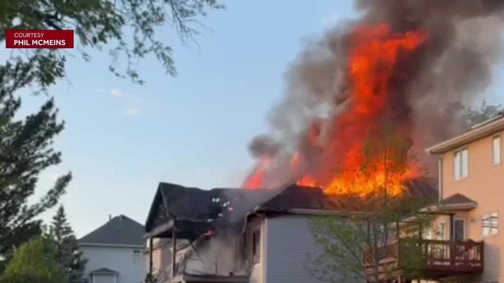 Video shows flames from roof during Johnston house fire
